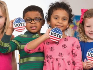 Image of children with voting badges