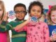 Image of children with voting badges