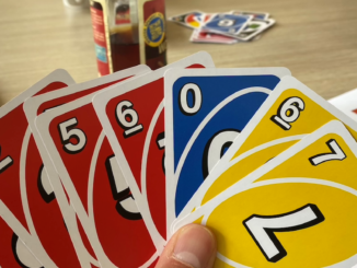 Hand holding Uno cards