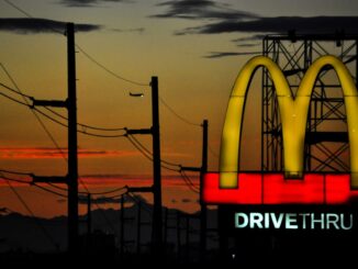 Image of McDonalds drive through sign at night